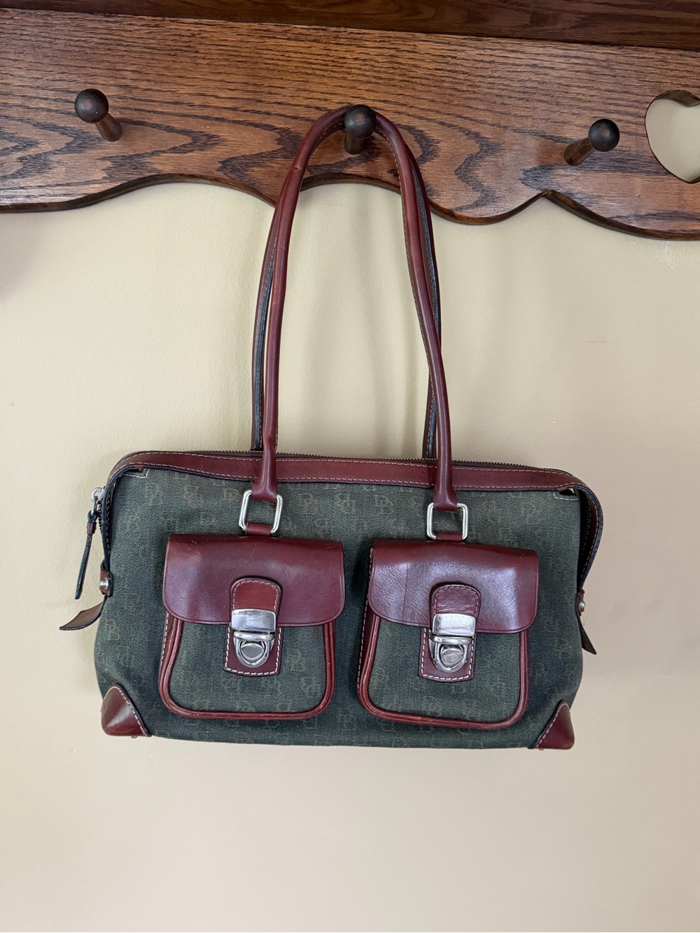Vintage Dooney & Bourke hand bag, green DB logo pattern with brown leather